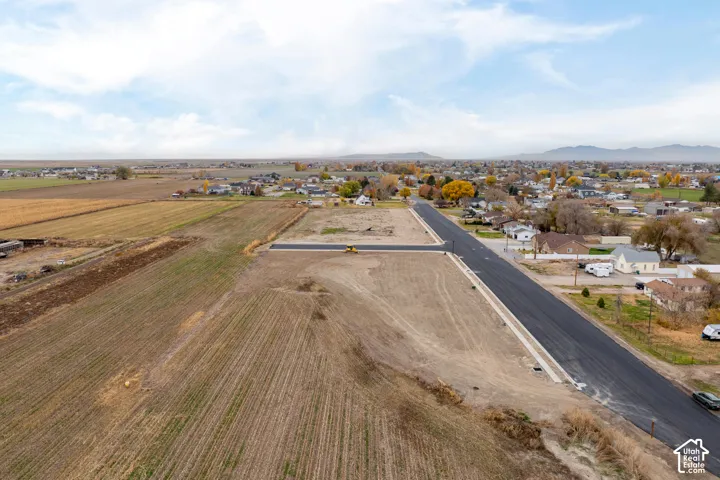 Cleared land parcels with new asphalt roadways and concrete curbs