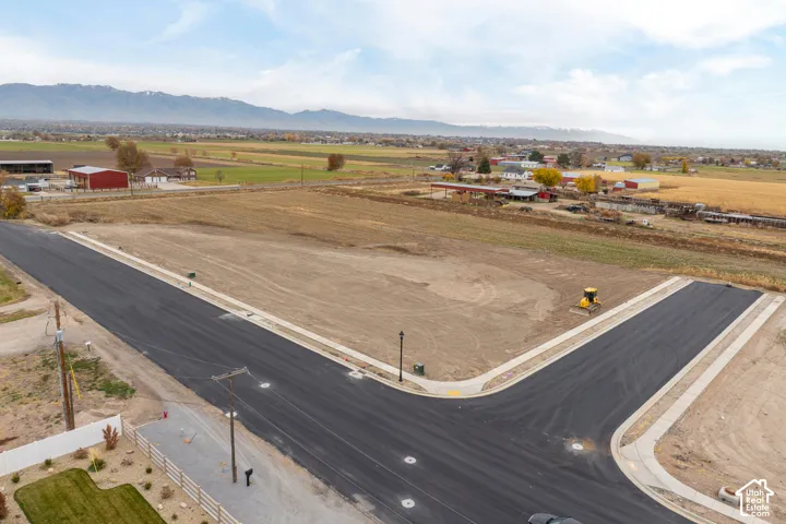 Newly paved asphalt roads and concrete sidewalks define the property's perimeter