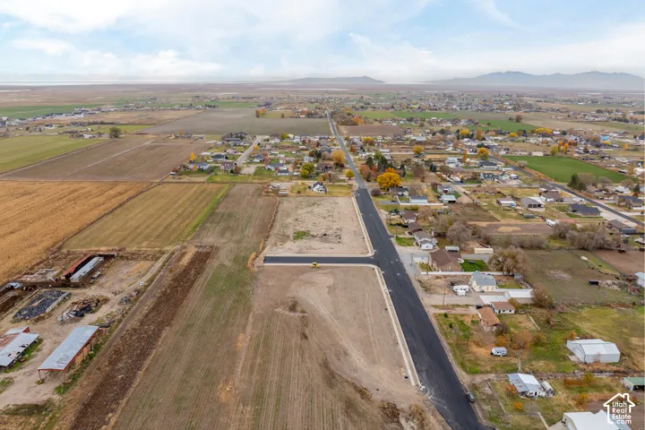 Expansive undeveloped land with a newly paved road