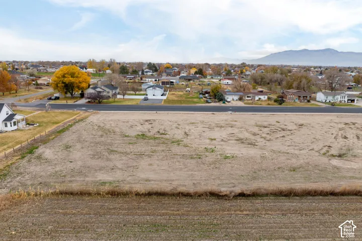Expansive undeveloped lot featuring clear land and road frontage