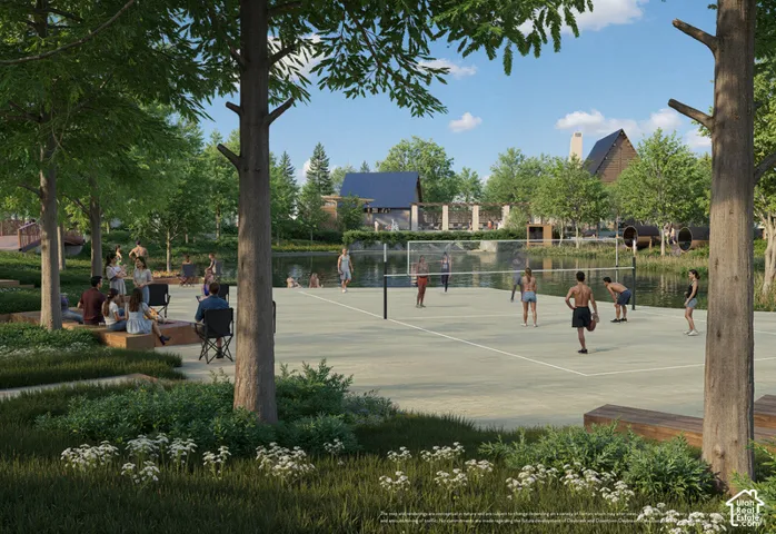 Outdoor volleyball court, adjacent to a body of water, with surrounding landscaped green spaces and trees