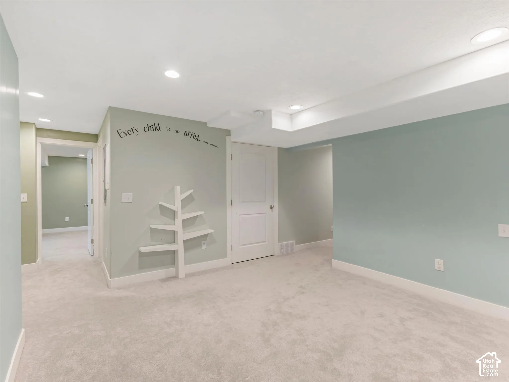 Recessed ceiling lighting, light-colored carpeting, white baseboards, and white paneled doors
