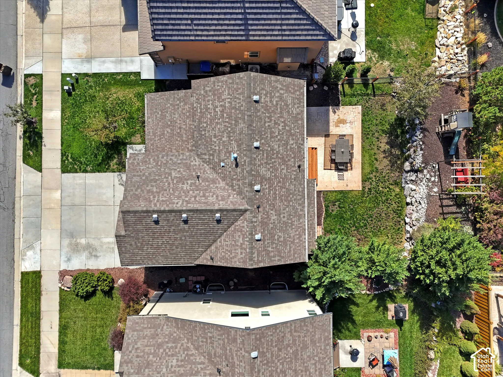 Pitched shingle roof with multiple ventilation features
