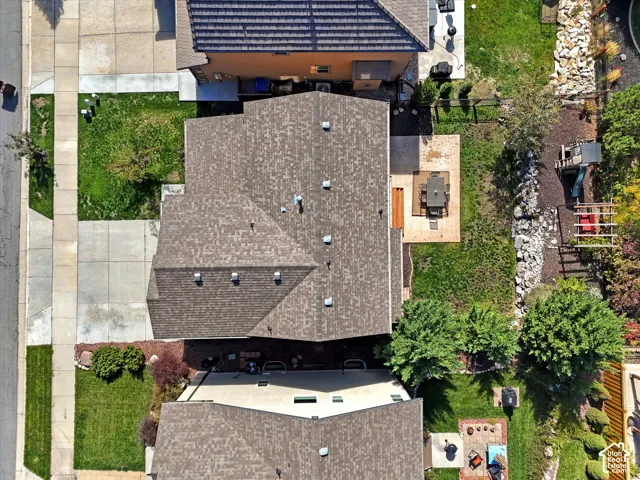 Pitched shingle roof with multiple ventilation features