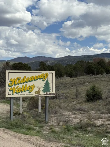 Signage indicating "Hideaway Valley" for a planned development