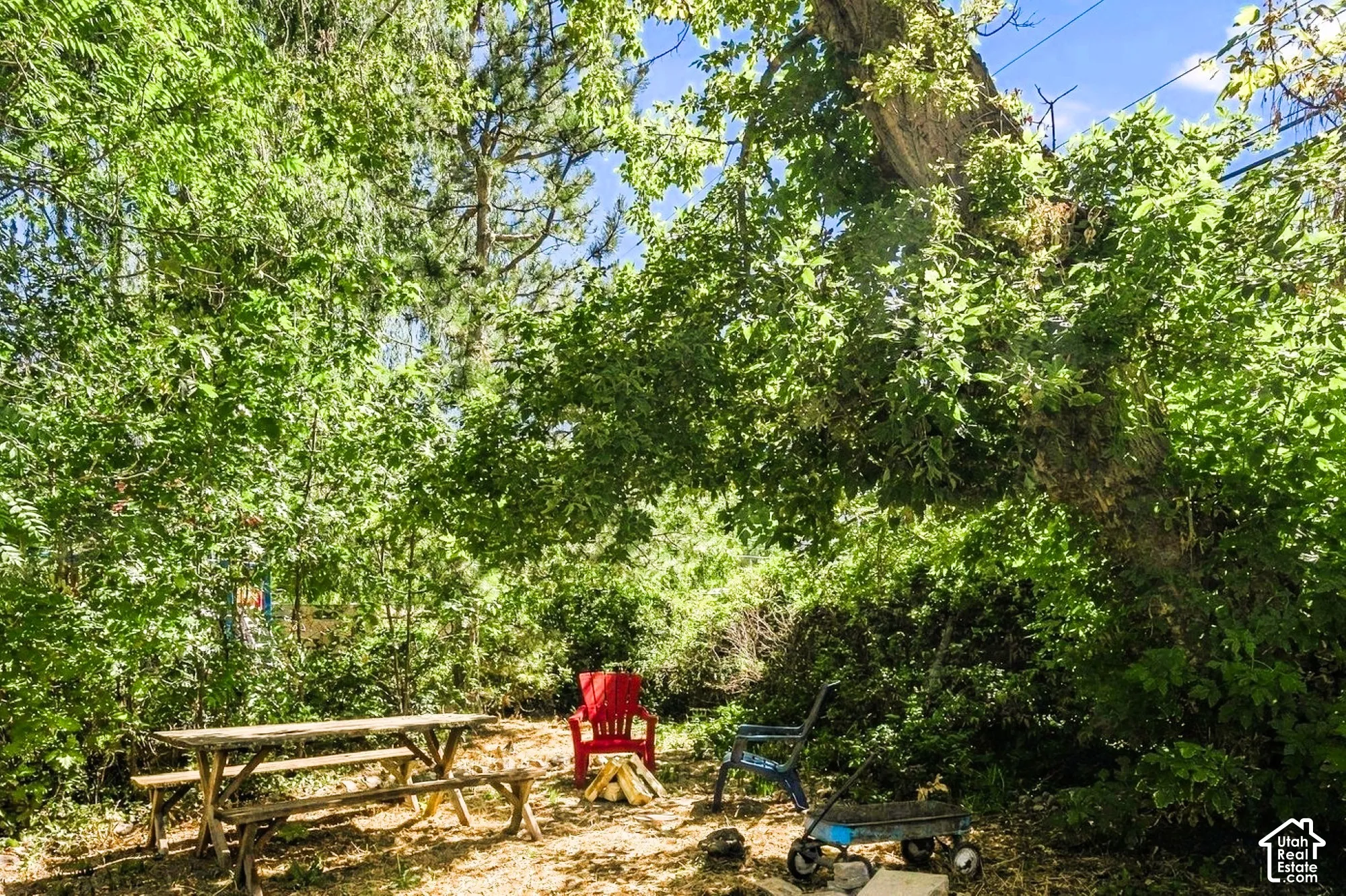 The sitting area at the corner of the backyard next to the brook