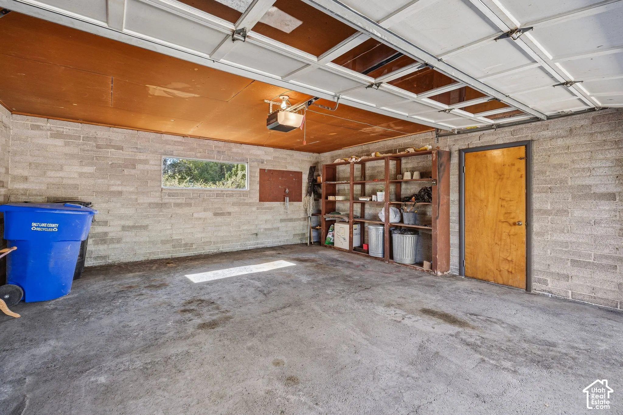 A garage with the door open up