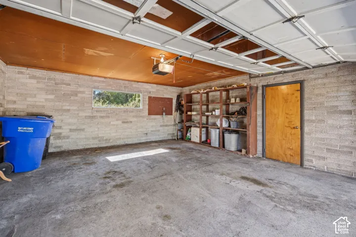 A garage with the door open up