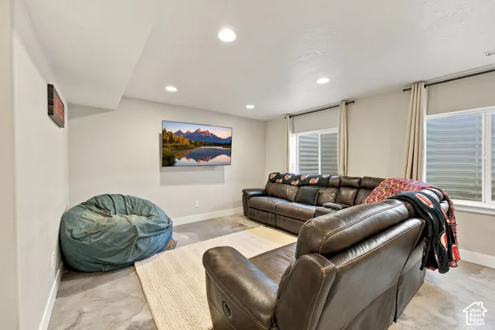 Recessed lighting and two windows with blinds