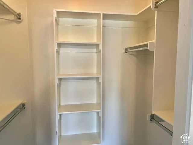 Built-in shelving, multiple hanging rods, and integrated storage solutions