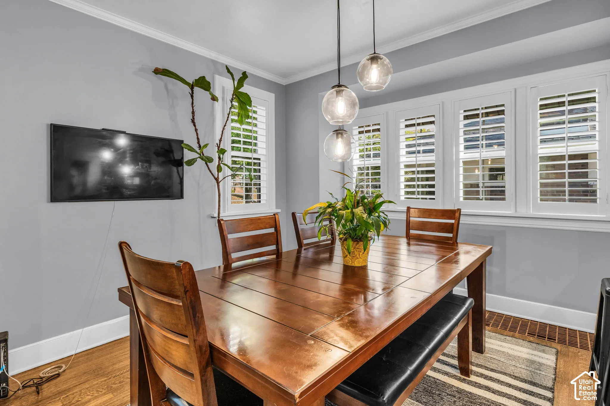 Wood-finish flooring with a white baseboard trim