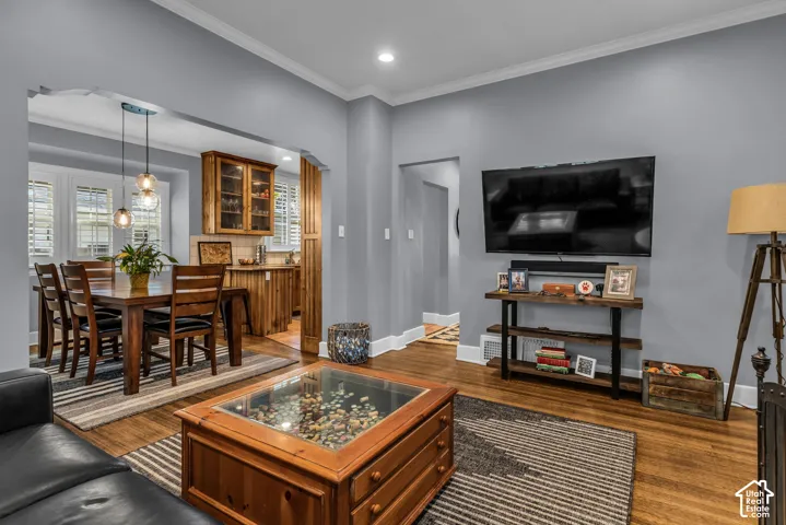 Hardwood-finish flooring, recessed lighting, and crown molding
