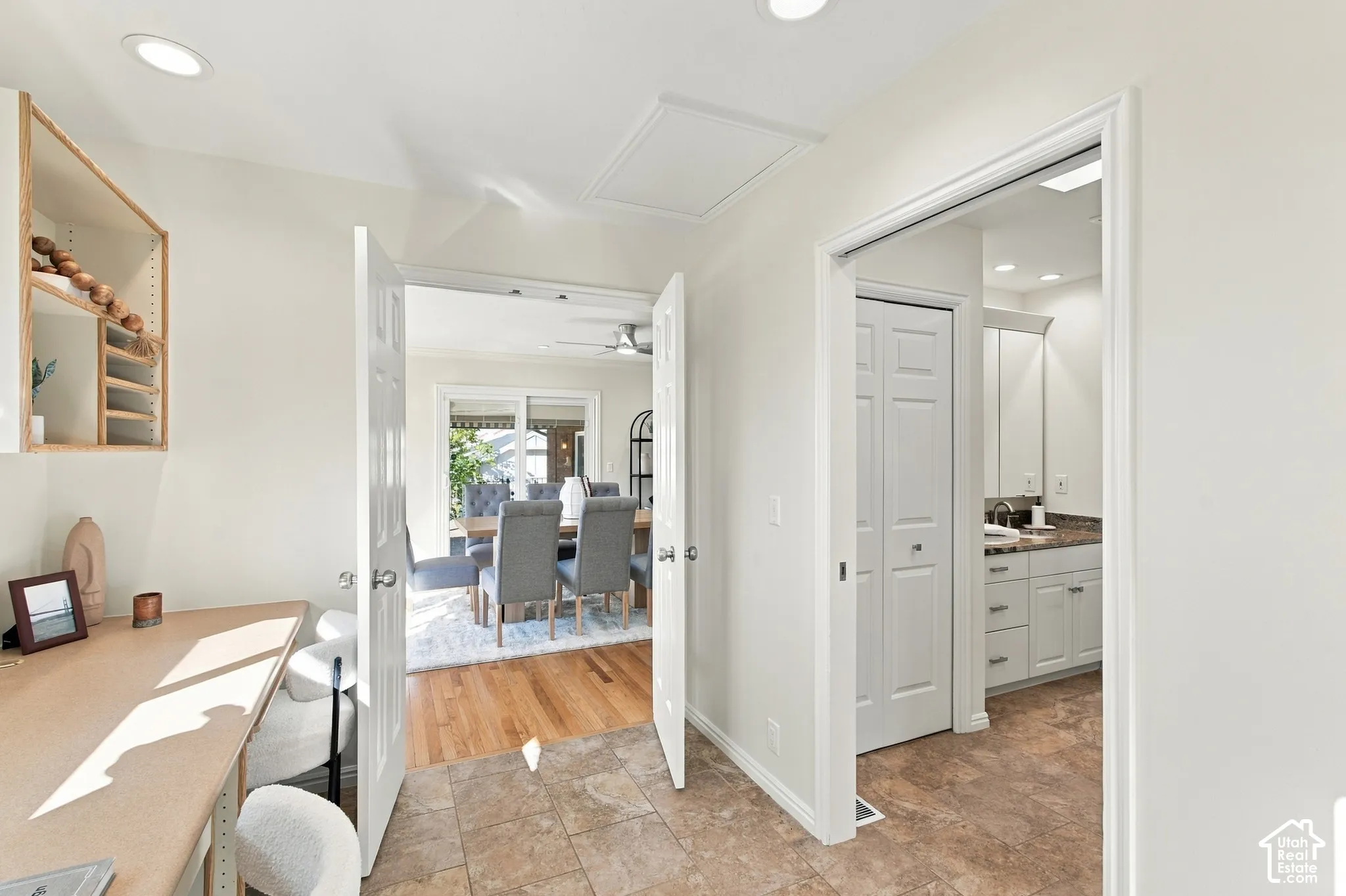 Tile flooring, recessed lighting, built-in shelving, wood-finish flooring, sliding glass door