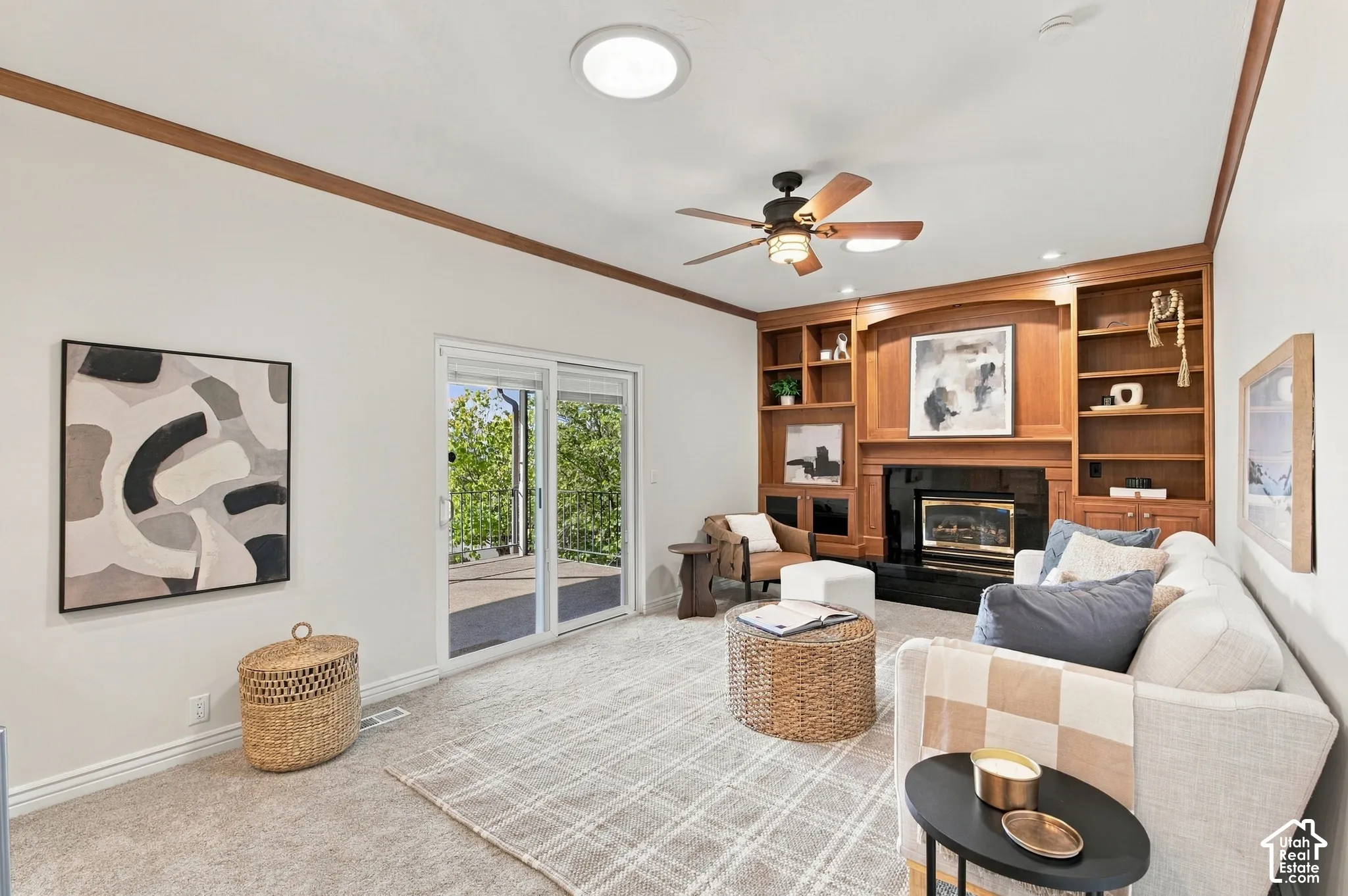 Built-in wooden cabinetry, recessed lighting, and a ceiling fan with integrated lighting