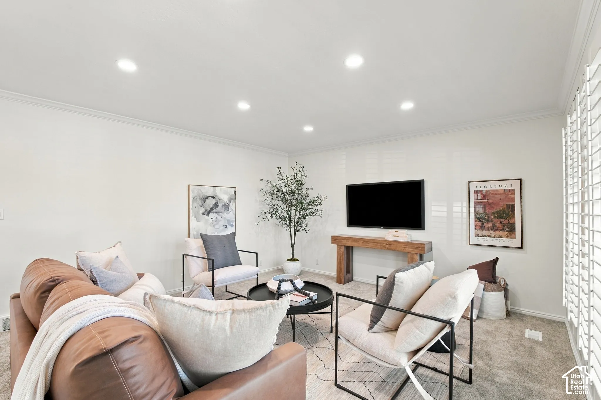 Recessed ceiling lighting, crown molding, plantation shutters, and textured wall finish