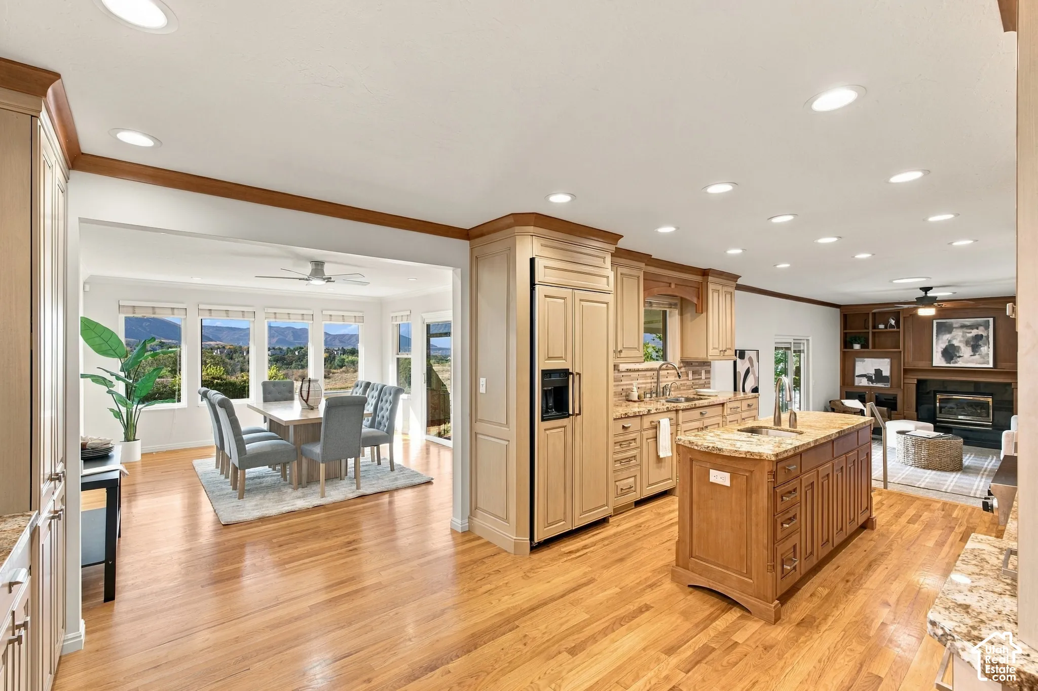 Kitchen featuring light-toned cabinetry, granite countertops, and a central island