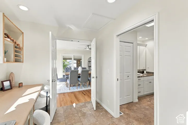 Tile flooring, recessed lighting, built-in shelving, wood-finish flooring, sliding glass door