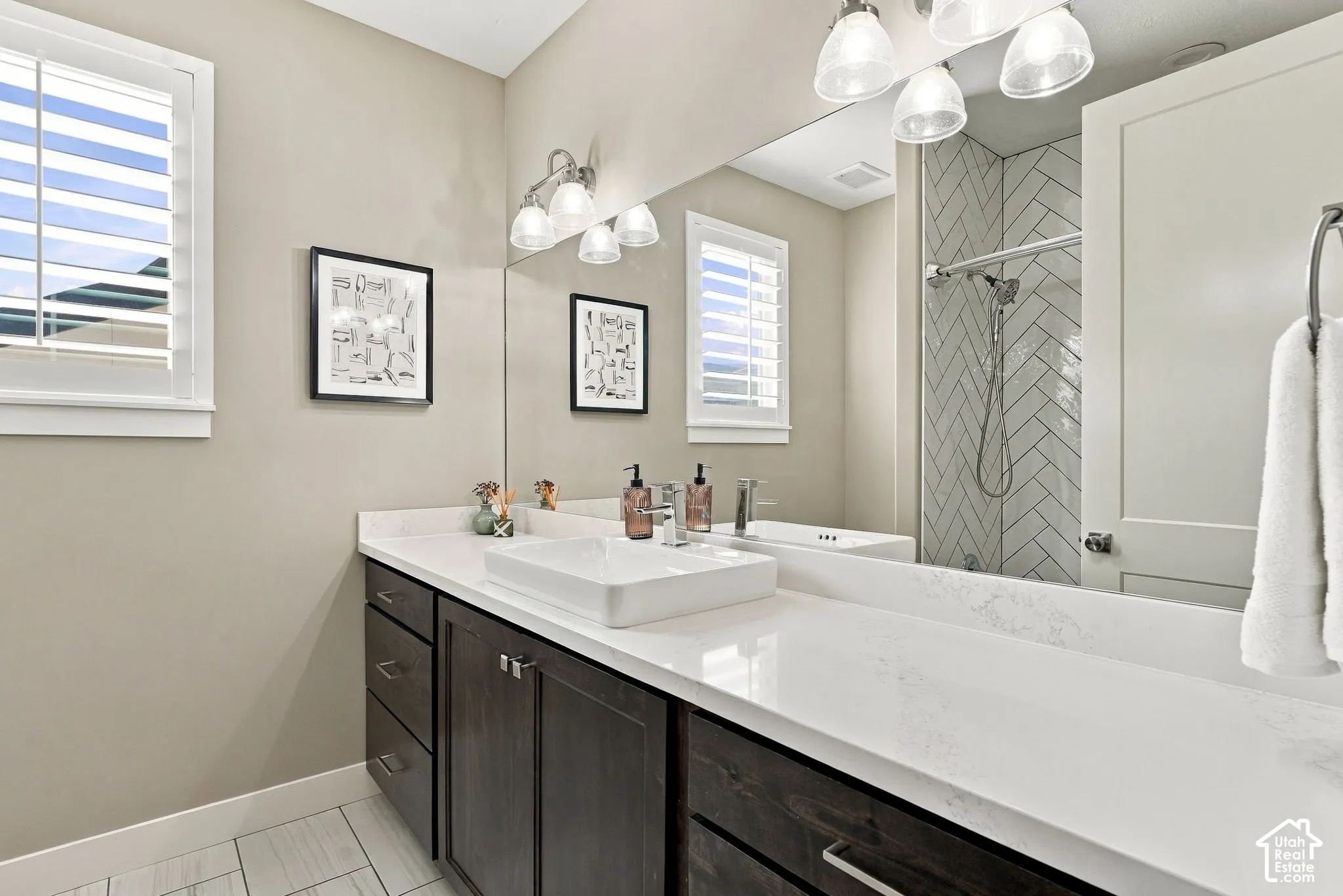 Main floor bathroom two, dark wood-finish vanity with a white rectangular vessel sink, white countertop, and brushed nickel fixtures