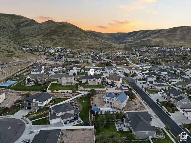 Residential community nestled against a mountainous backdrop