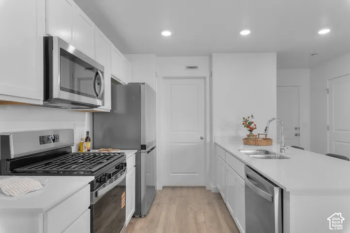 White cabinetry with stainless steel hardware