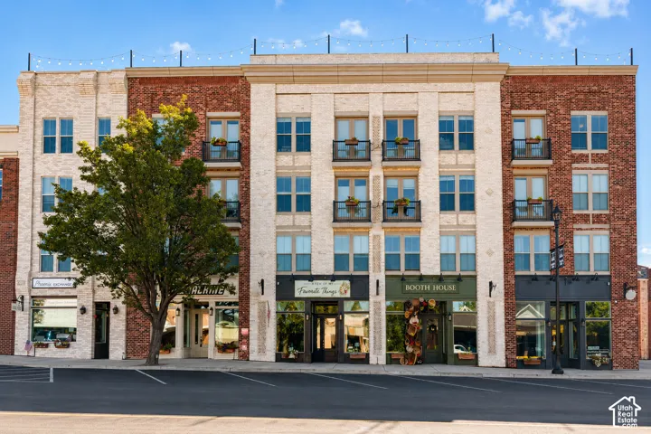 Mixed-material facade featuring brick and light-toned masonry