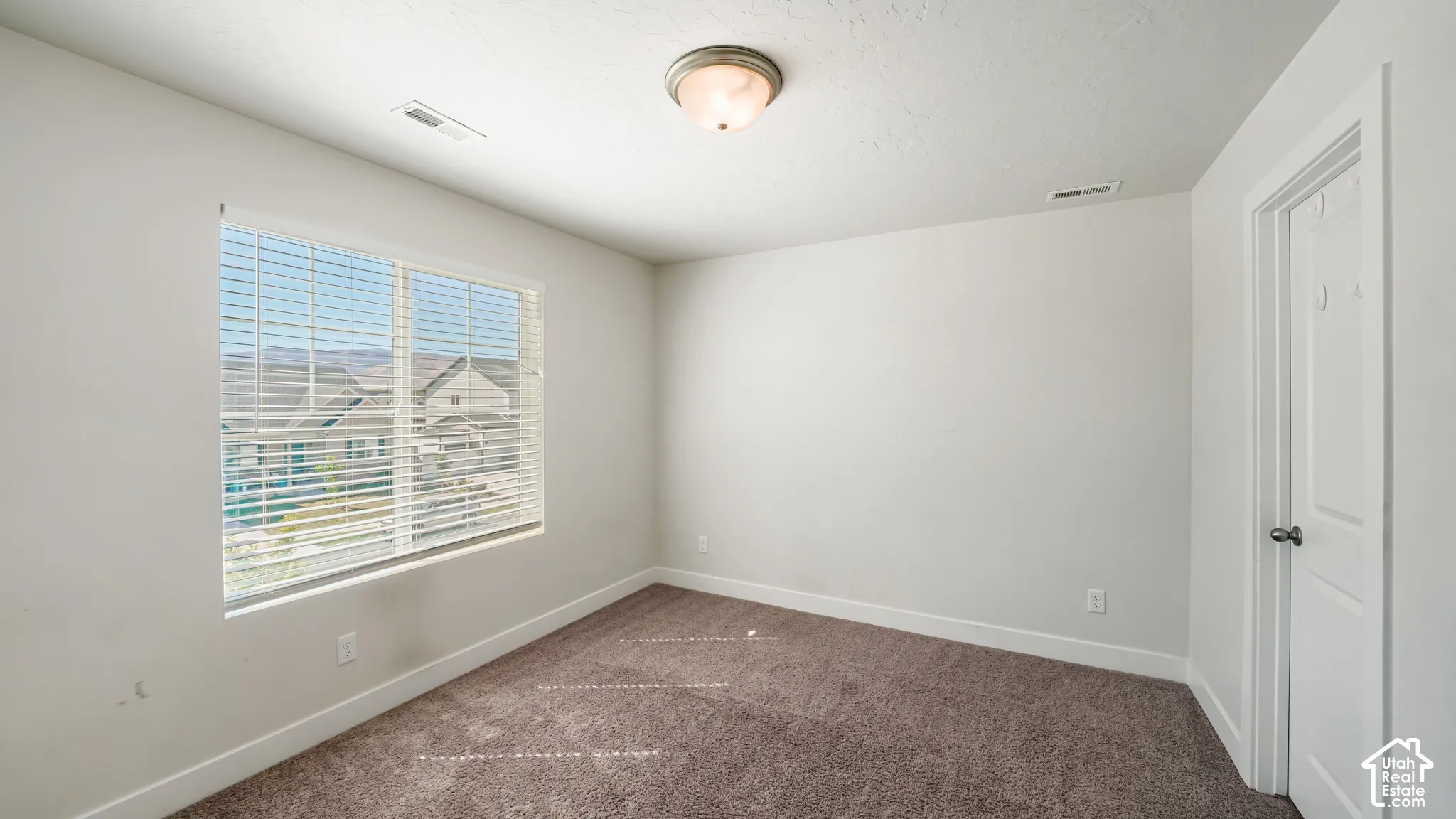 BEDROOM 2 W/ WALK-IN CLOSET & VIEWS