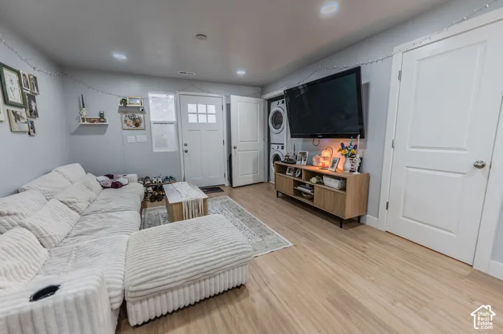 Recessed lighting illuminates wood-finish flooring
