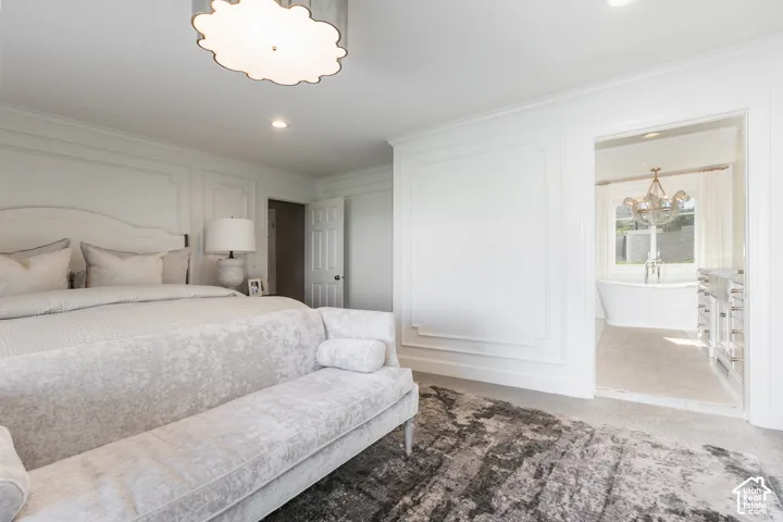 Recessed ceiling lighting, decorative wall molding, and a built-in overhead light fixture