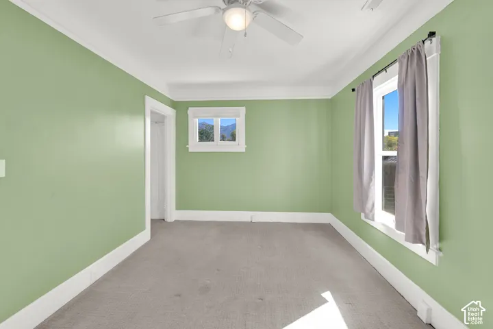 Recessed ceiling fan with light fixture, wall-to-wall carpeting, and two windows