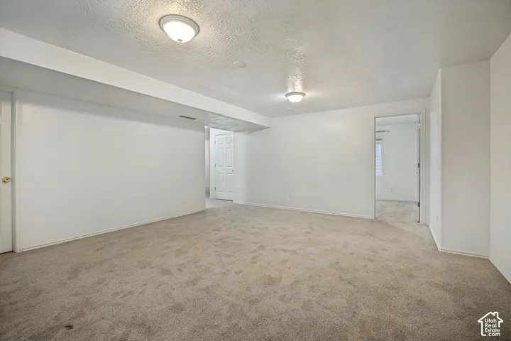 Neutral-toned carpeting throughout