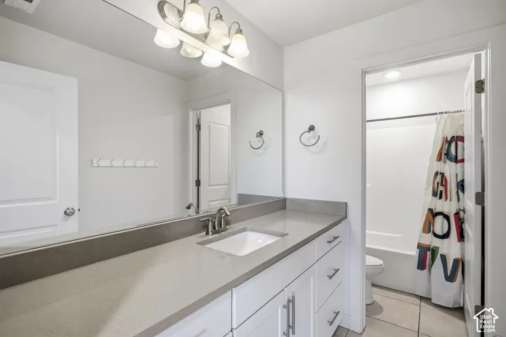 Dual-sink vanity with a light-toned countertop, undermount sinks, and brushed nickel faucets