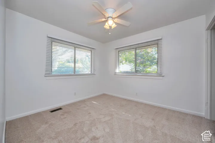Upstairs back bedroom with new carpeting and new paint