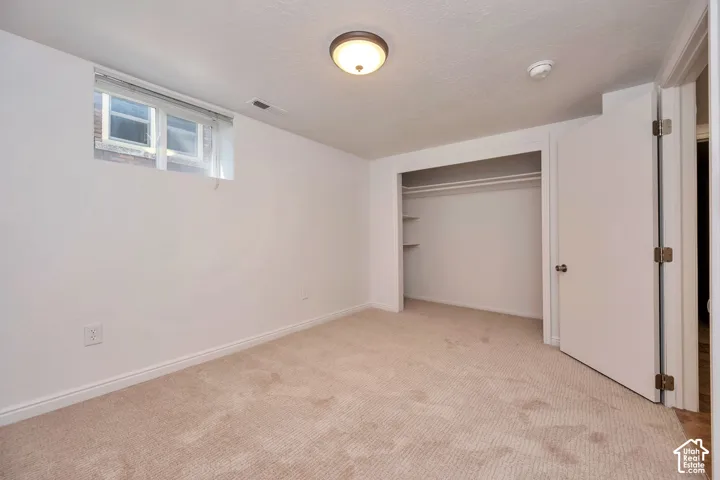 Bedroom one downstairs with new carpet and paint