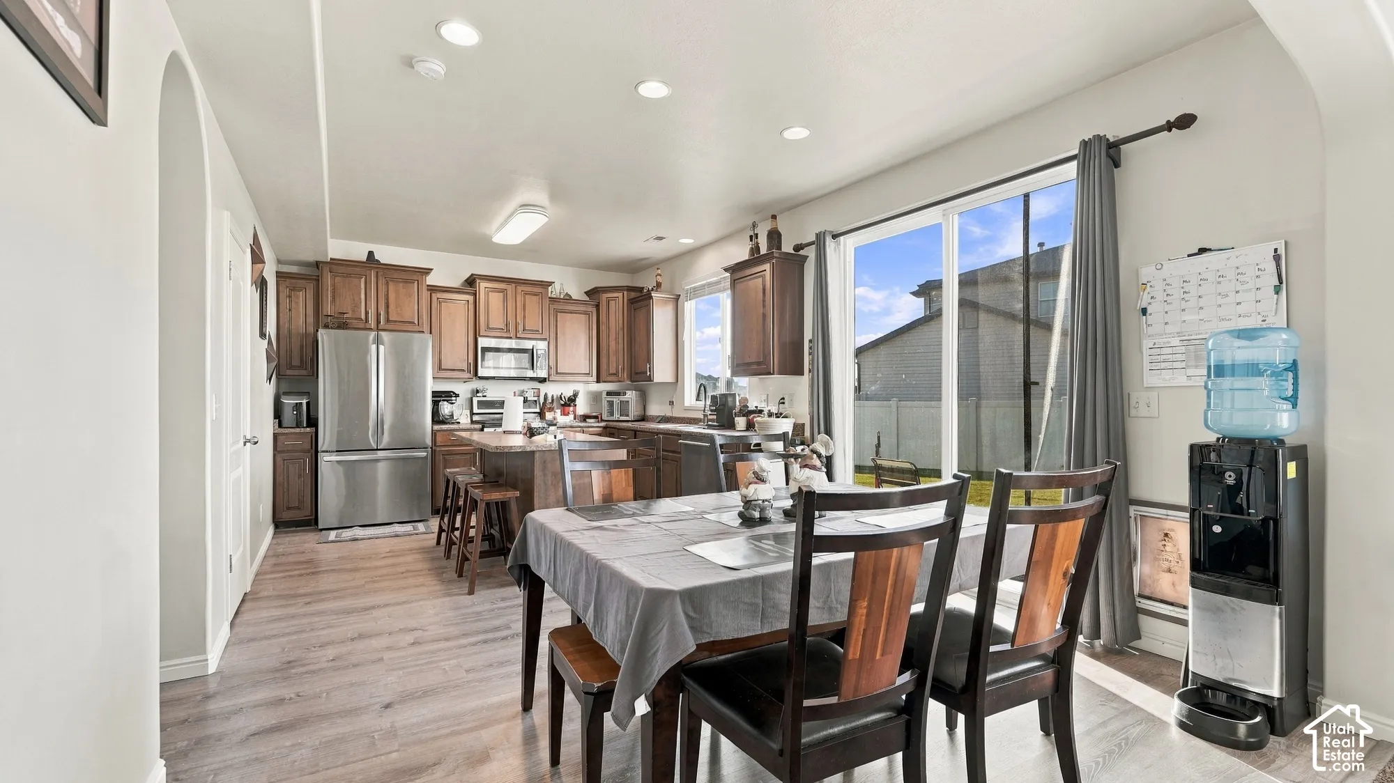 Open concept living area with wood-finish flooring