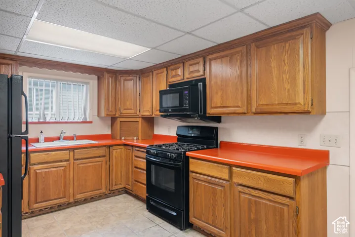 Wood-finish cabinetry paired with orange countertops