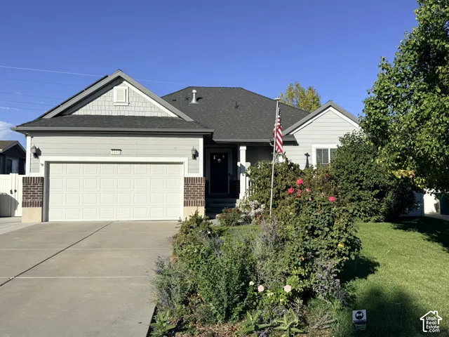 Light gray exterior siding with dark gray roof shingles