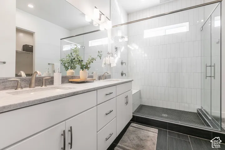 Dual vanity with light-toned countertops and undermount sinks