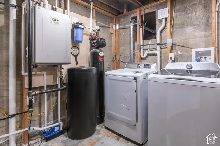 Laundry room and newly installed tankless water heater and water softner