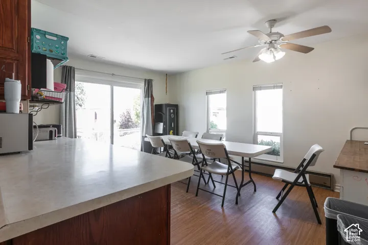 Large dining area with a sliding door to the back yard to the West.