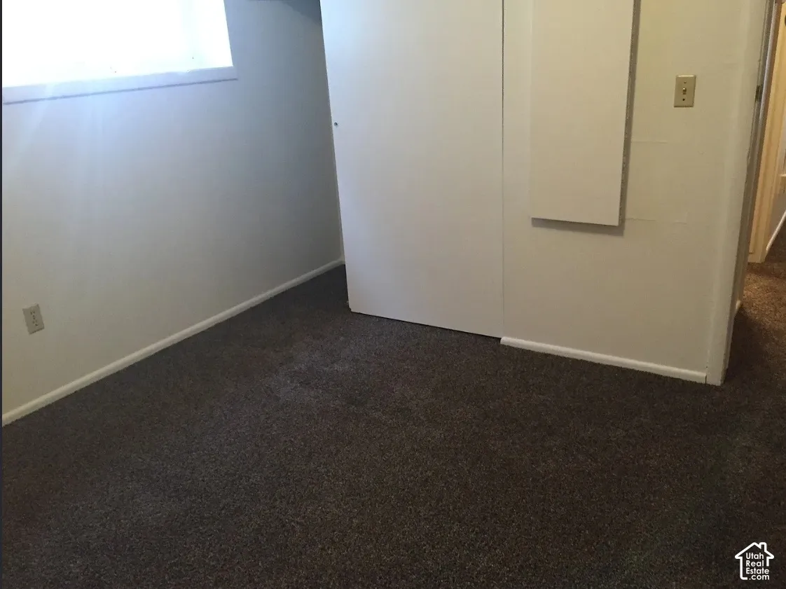 Wall-to-wall carpeting and neutral wall tones