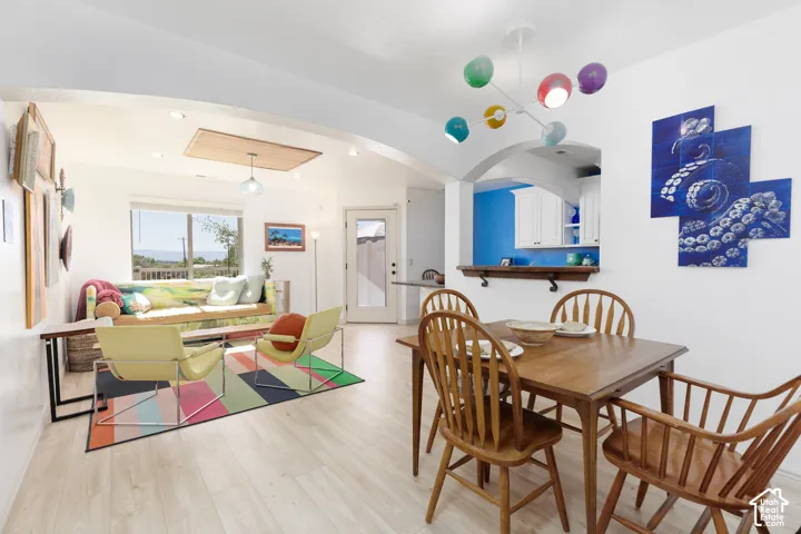 Open living area with light wood-finish flooring