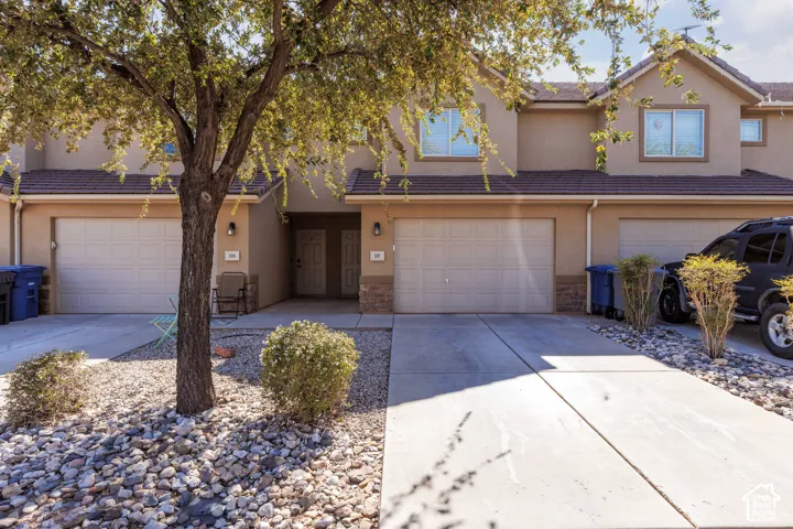 Two-story stucco exterior with attached garage