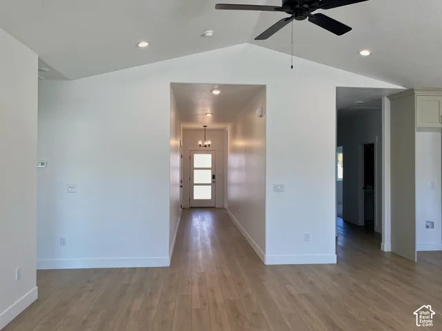 *COMPARABLE HOME, EXAMPLE OF LISTING AFTER COMPLETION. Vaulted ceiling with recessed lighting and a ceiling fan, wood-finish flooring, and a contemporary front door with frosted glass panels