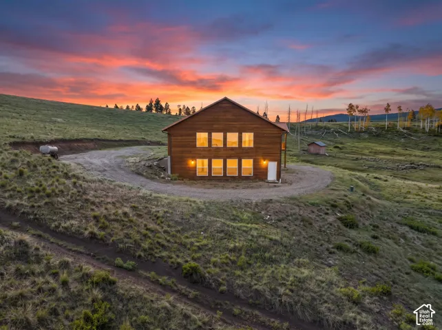 Exterior: The gravel drive loops around the home, with room for trailer parking.