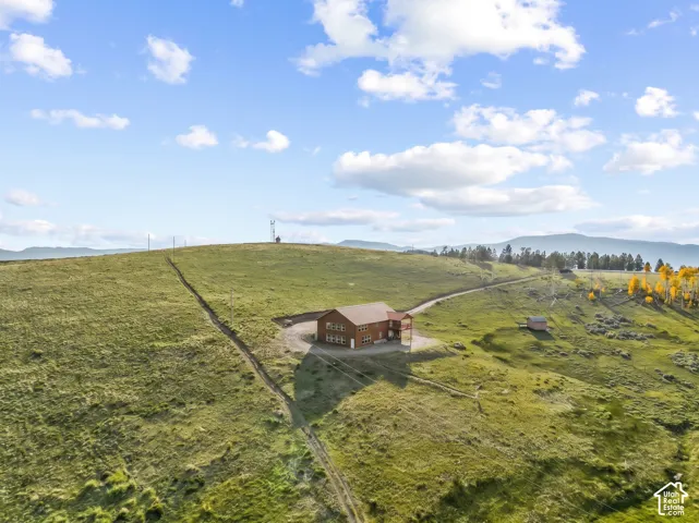 Exterior: The cabin sits on 2.25 open acres in the high country near Fish Lake, with a storage shed just below the home.