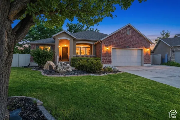 Brick and stucco exterior with an arched entry
