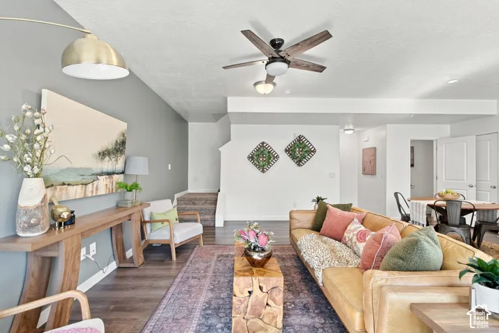 Wood-finish flooring, recessed lighting, and a ceiling fan with integrated lighting