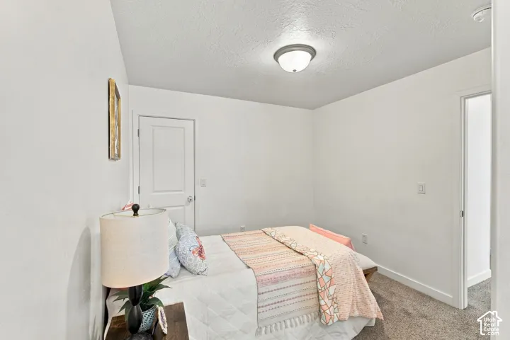 White walls and trim with a textured ceiling
