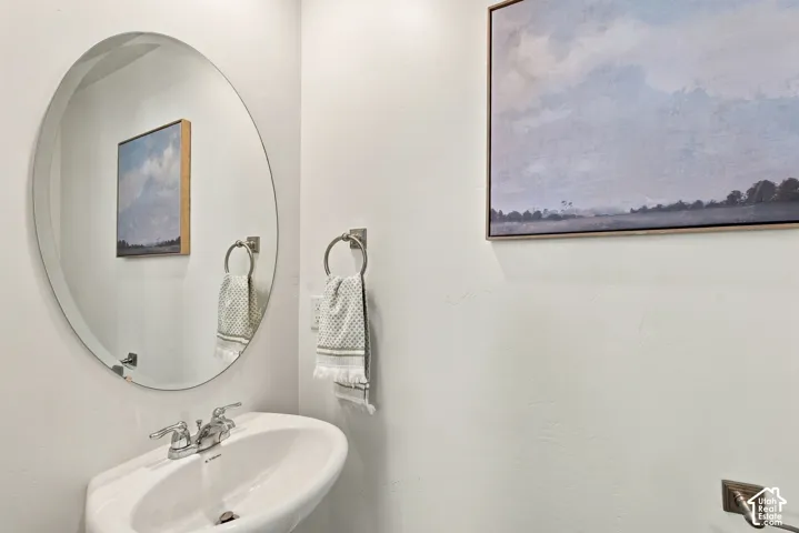 Pedestal sink with chrome faucet