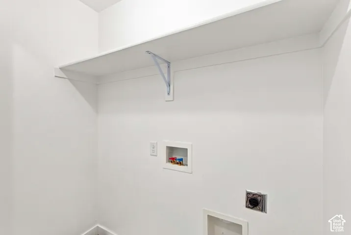 White walls with a single white shelf and support bracket